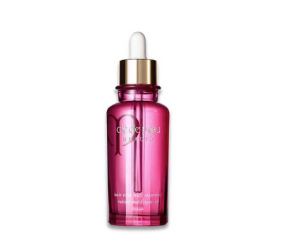 Pink serum bottle with dropper on a white background