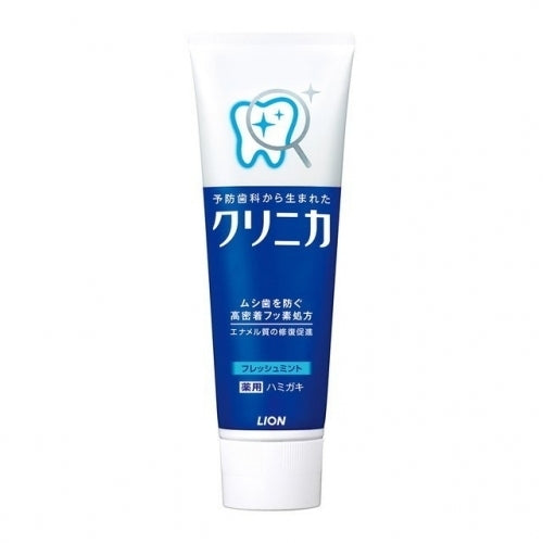 A tube of LION Clinica toothpaste with blue and white packaging.