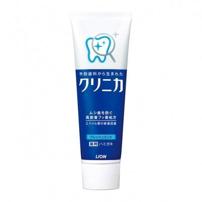 A tube of LION Clinica toothpaste with blue and white packaging.