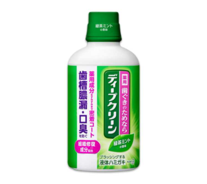 Bottle of dental care product with green and white design on a white background