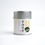 A tin can of Kamitsujien Uji Matcha green tea powder with Japanese text and a picture of a tea leaf on the label.