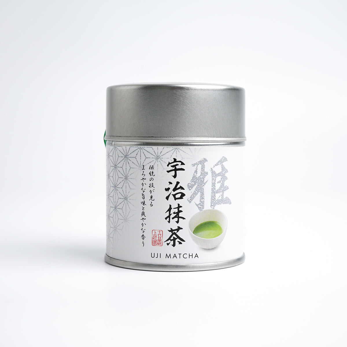 A tin can of Kamitsujien Uji Matcha green tea powder with Japanese text and a picture of a tea leaf on the label.
